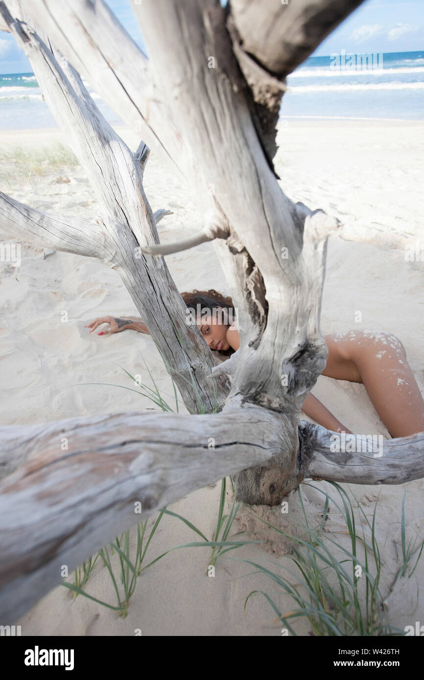 Girl lying down on the beach nude A Nude Young Lady Is Sleeping In Sand At Beach Under Woods Stock Photo Alamy