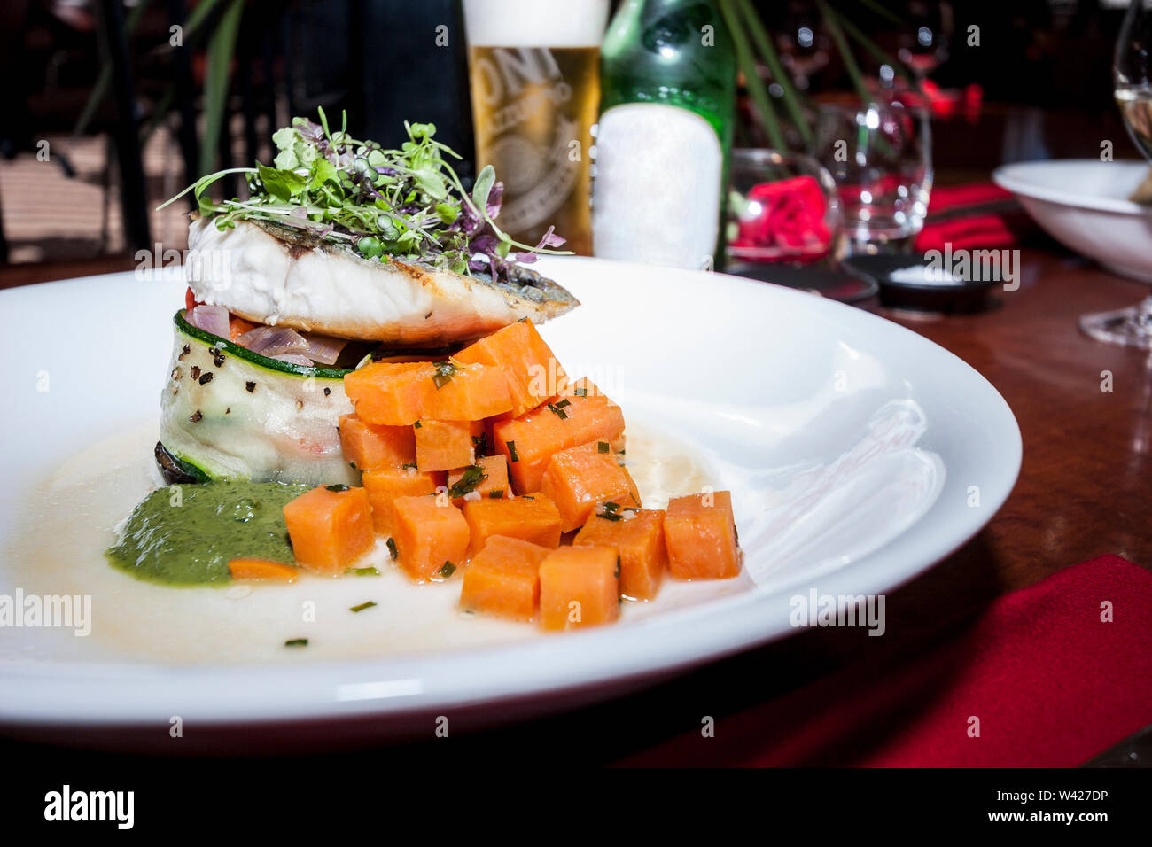 Fruits mixed onion salad on plate, hot food including meat and ...