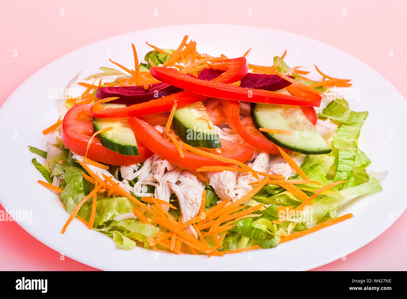 Fruits and vegetables mixed salad bowl, hot burger including meat and