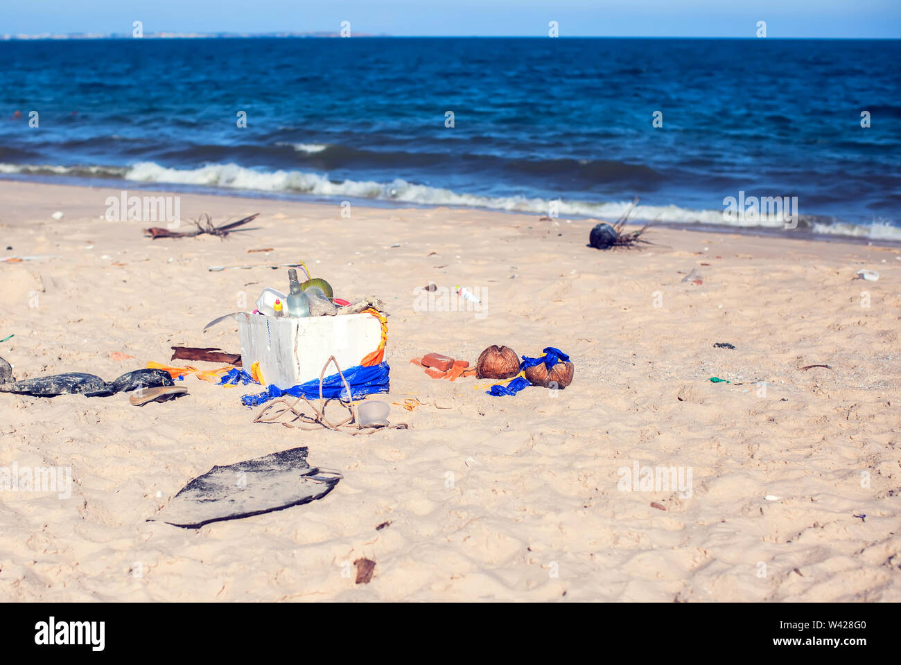 Pollutions and garbages in the sea and on the beach Stock Photo