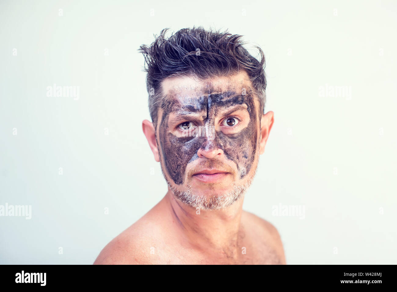 Touching a mask hi-res stock photography and images - Alamy