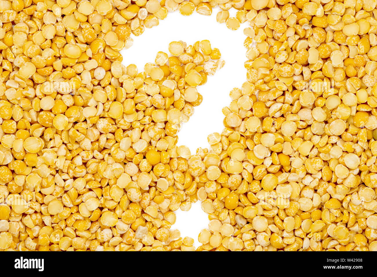 Yellow split dried peas, question mark, isolated, close up, macro, top