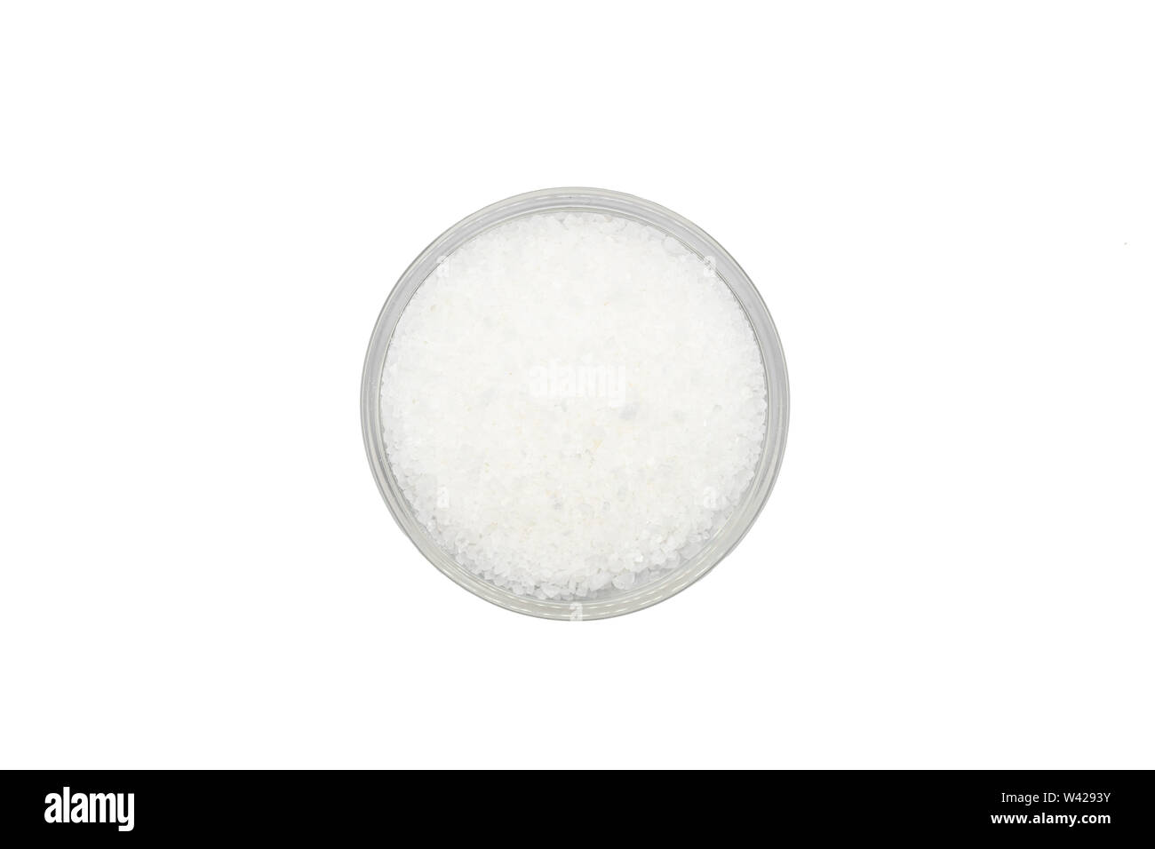Table salt in bowl, isolated, close up, macro, top view. Universal