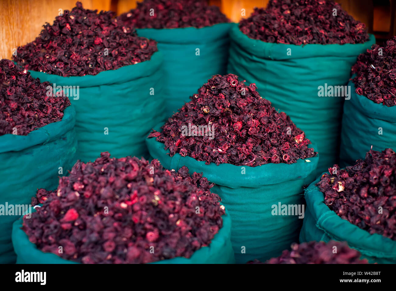 Dry herb hibiscus for tea in baskets. Arabic herbs on traditional bazaar. Natural organic food. Stock Photo