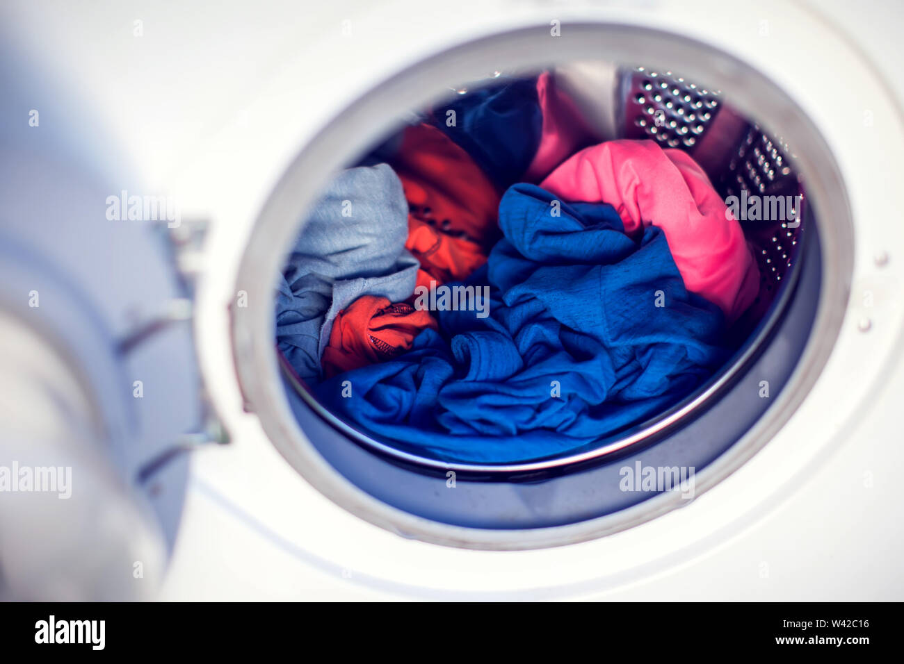 A Close Up Washing Machine With Color Clothes Stock Photo Alamy