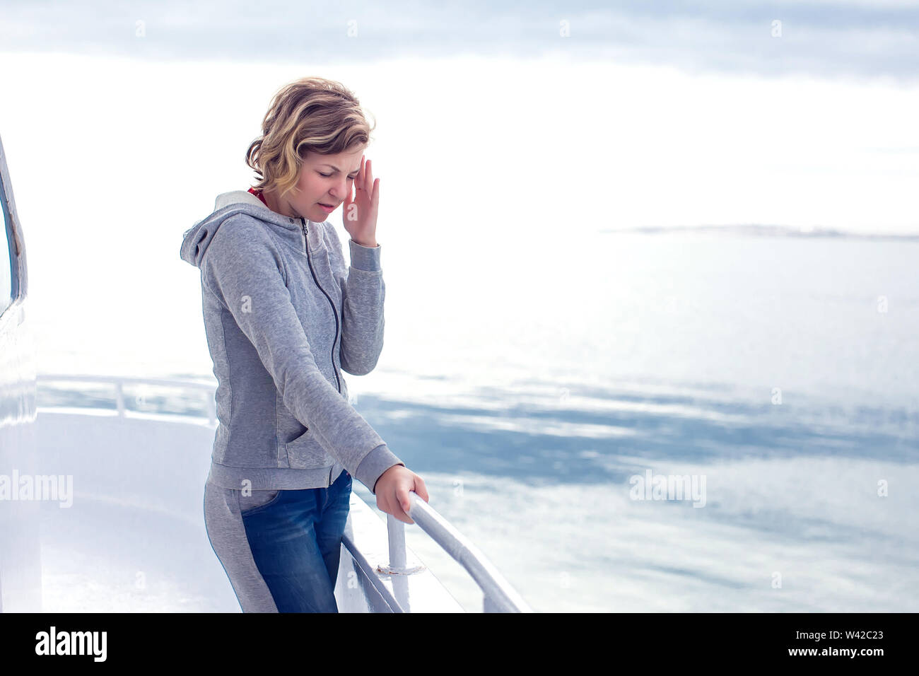 Cruise sea motion sickness tourist woman seasick on boat vacation with