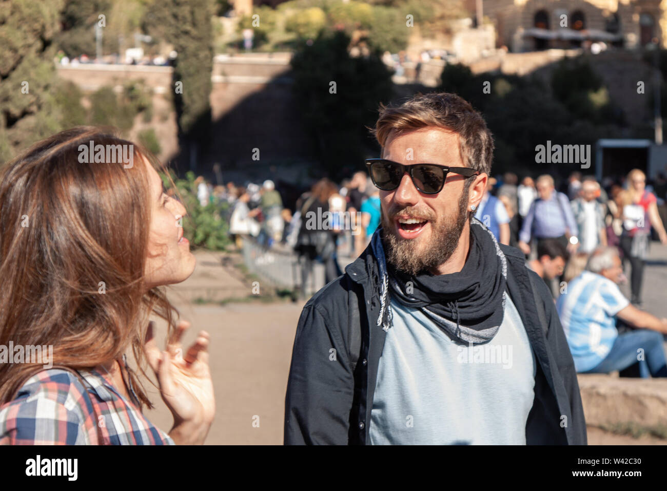Happy young couple tourists in front colosseum square in rome Stock Photo