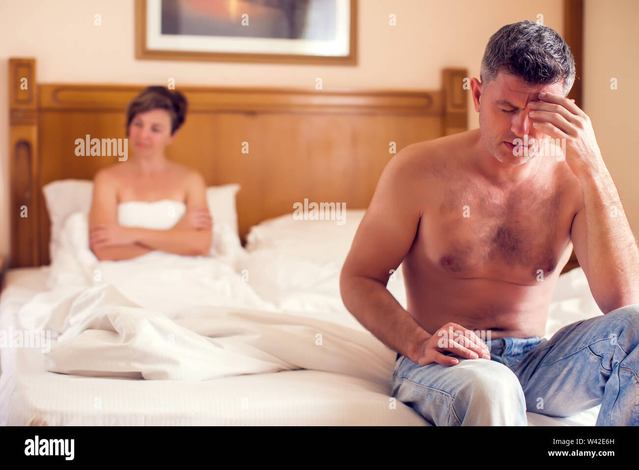 People, relationship difficulties, conflict and family concept - unhappy couple having problems at bedroom Stock Photo