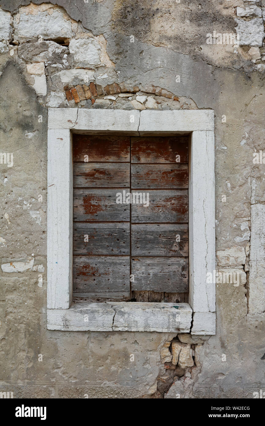Old stone window frame with wooden shutters,Porec,Istria,Croatia Stock Photo