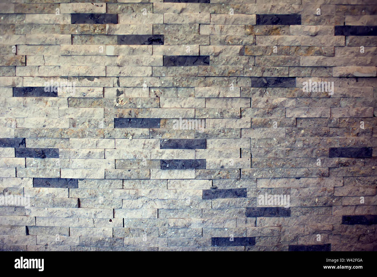 Closeup surface brick pattern at old stone brick wall textured background Stock Photo