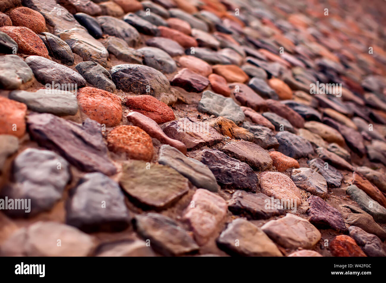 Pebble wall are made of stones of different sizes. Natural background