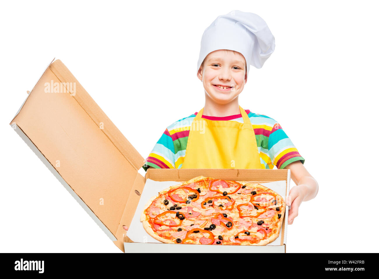 little cook in pizza cap in box on white background in studio Stock Photo