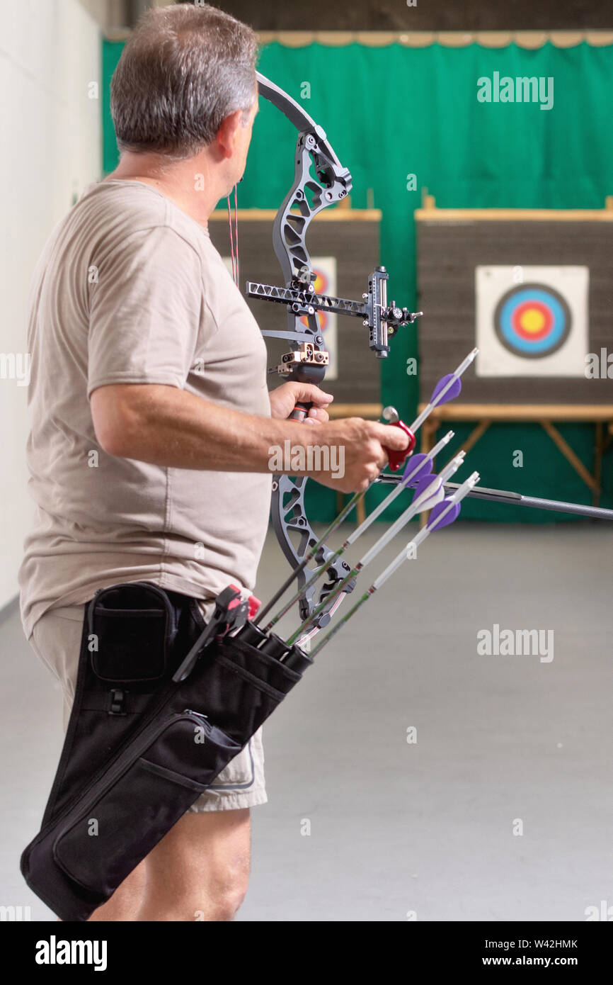 Archer Training With The Bow. Shooting the target in the background
