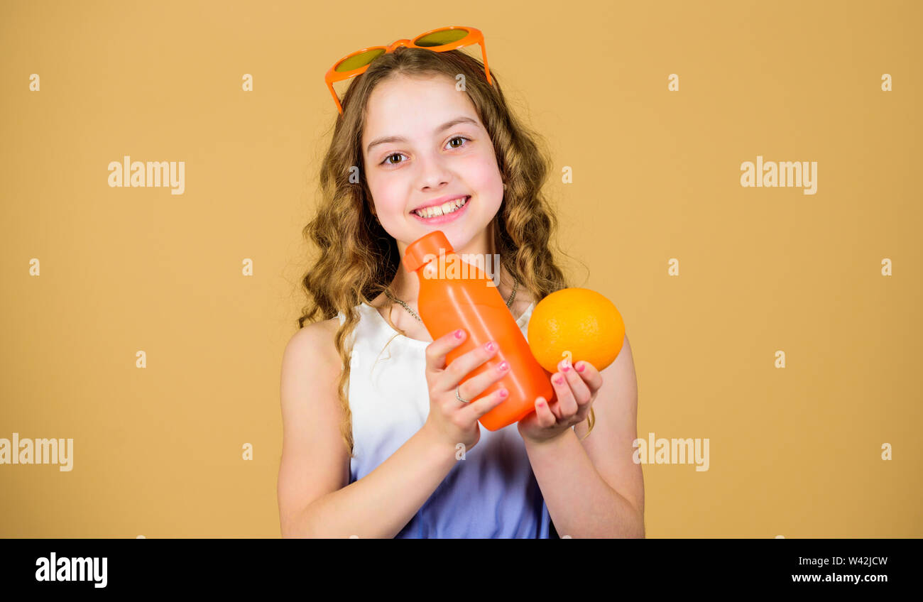 happy girl drink fresh orange juice. summer vacation. little girl in ...