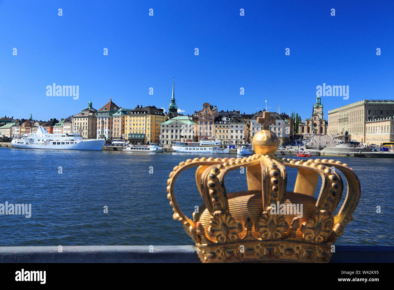 Scenic view of Stockholm's Old Town (Gamla Stan) skyline with the royal golden crown on the foreground, Sweden Stock Photo