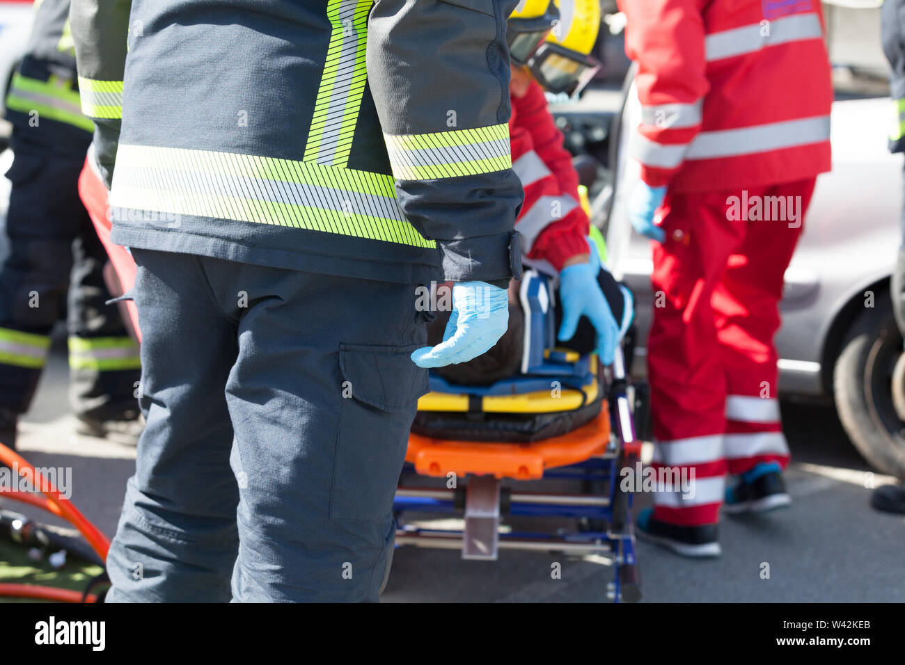 Paramedics and firefighters in a rescue operation after road traffic