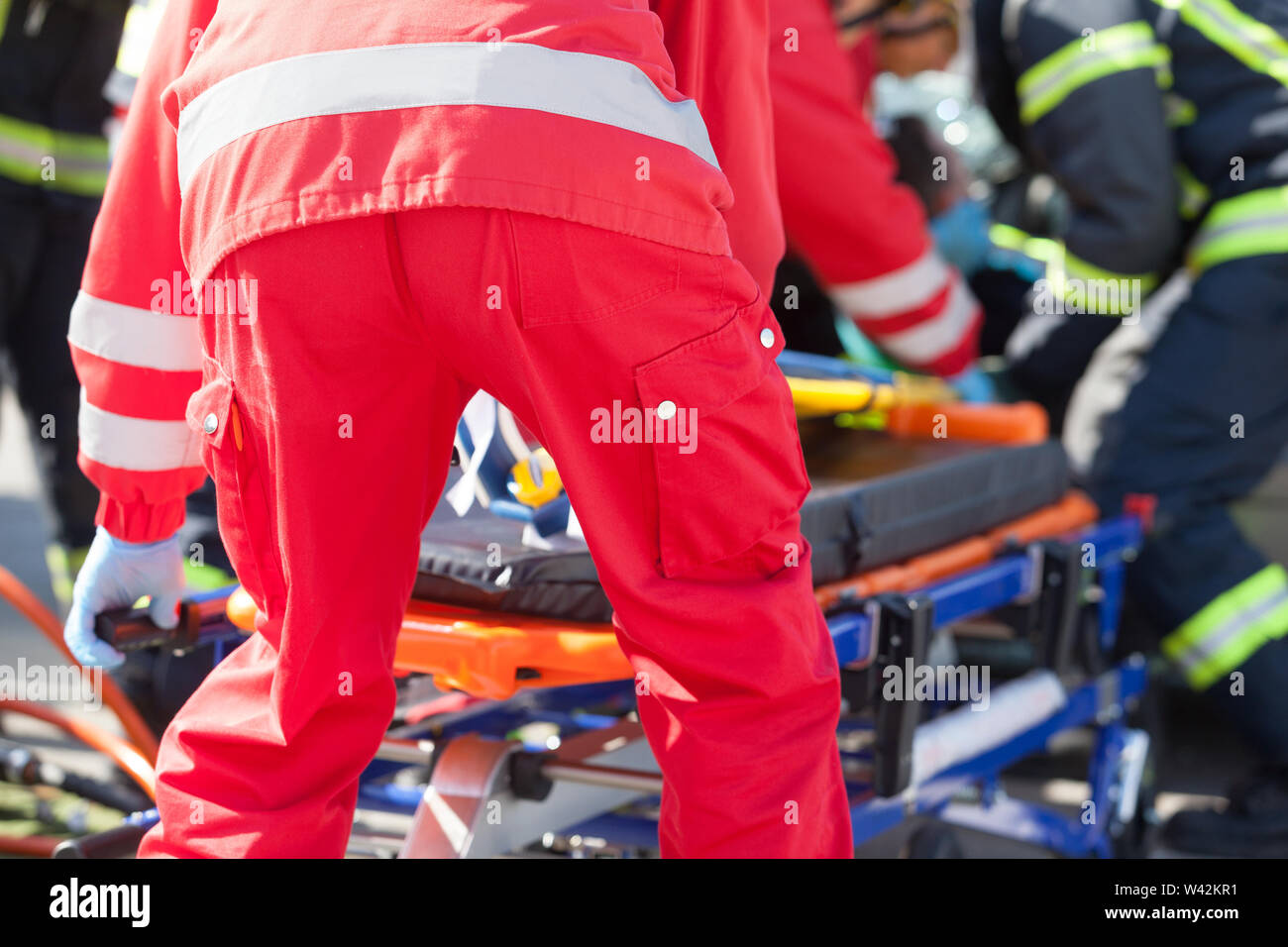 Paramedics and firefighters in urgent rescue operation after a car ...