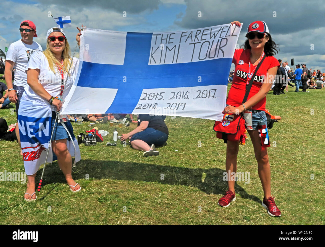 Formula One Fans,with flag,The Farewell Kimi Tour, flag, 2015,2016,2017,2018,2019, Silverstone Circuit, Towcester,Northamptonshire, UK Stock Photo