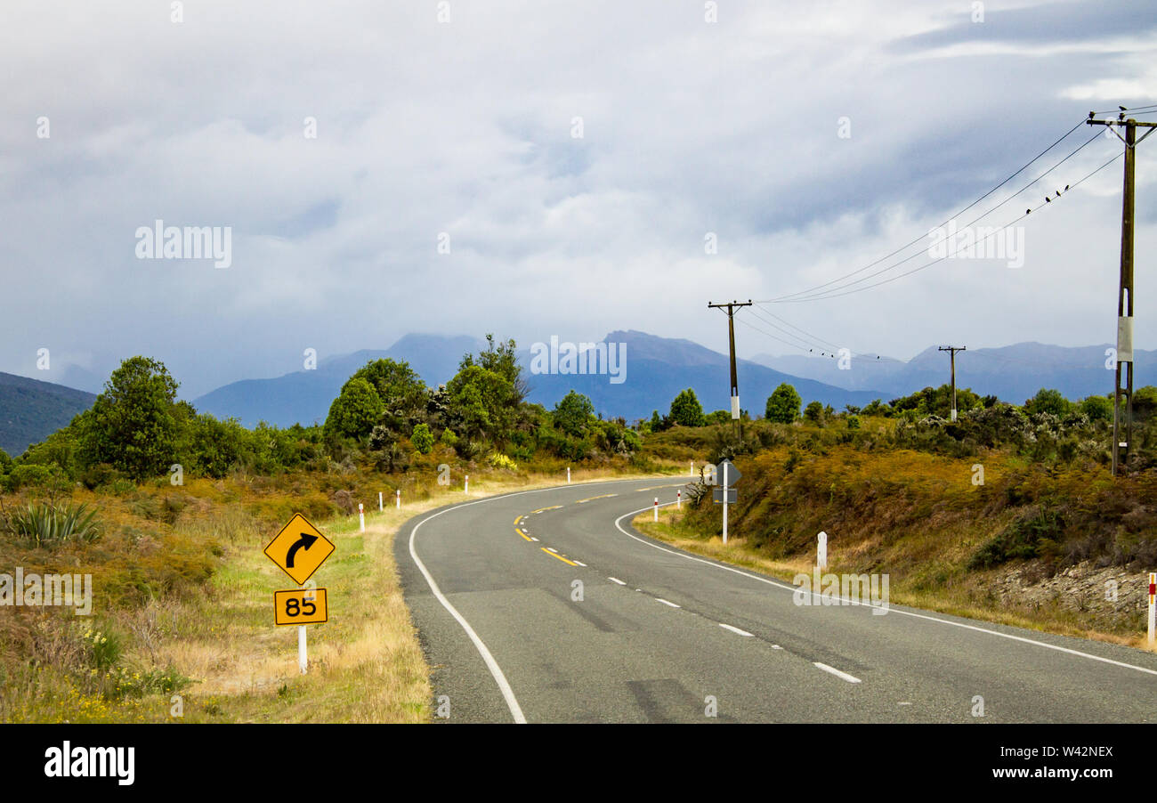 Road curving the wilderness area around Te Anau, New Zealand Stock Photo