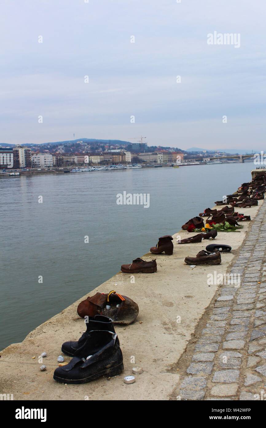 The 'Shoes On The Danube Bank' memorial in Budapest, commemorating the Hungarian Jews who were shot into the Danube during the Hungarian Holocaust. Stock Photo