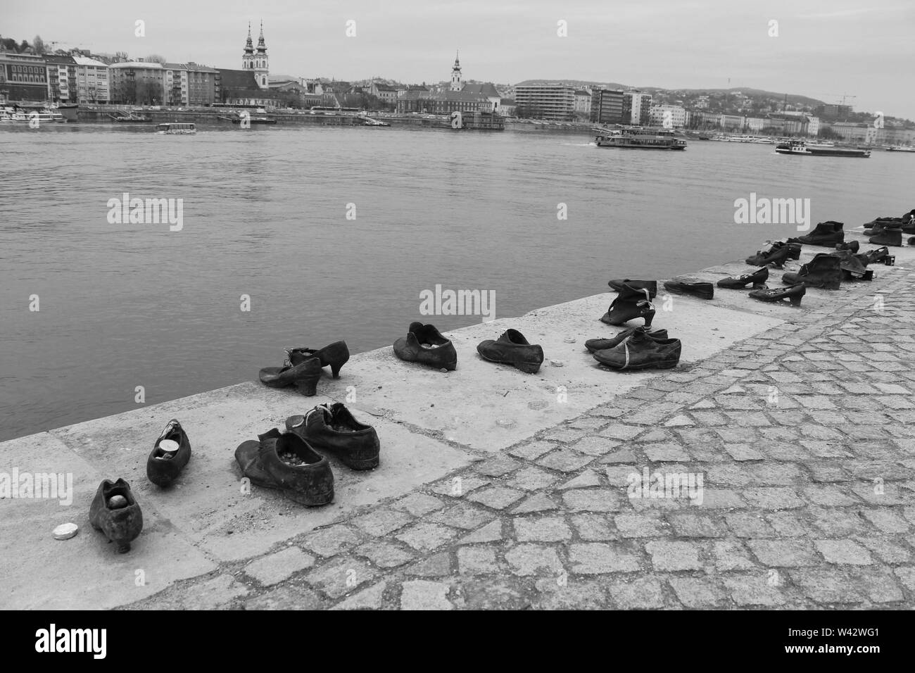 The 'Shoes On The Danube Bank' memorial in Budapest, commemorating the Hungarian Jews who were shot into the Danube during the Hungarian Holocaust. Stock Photo