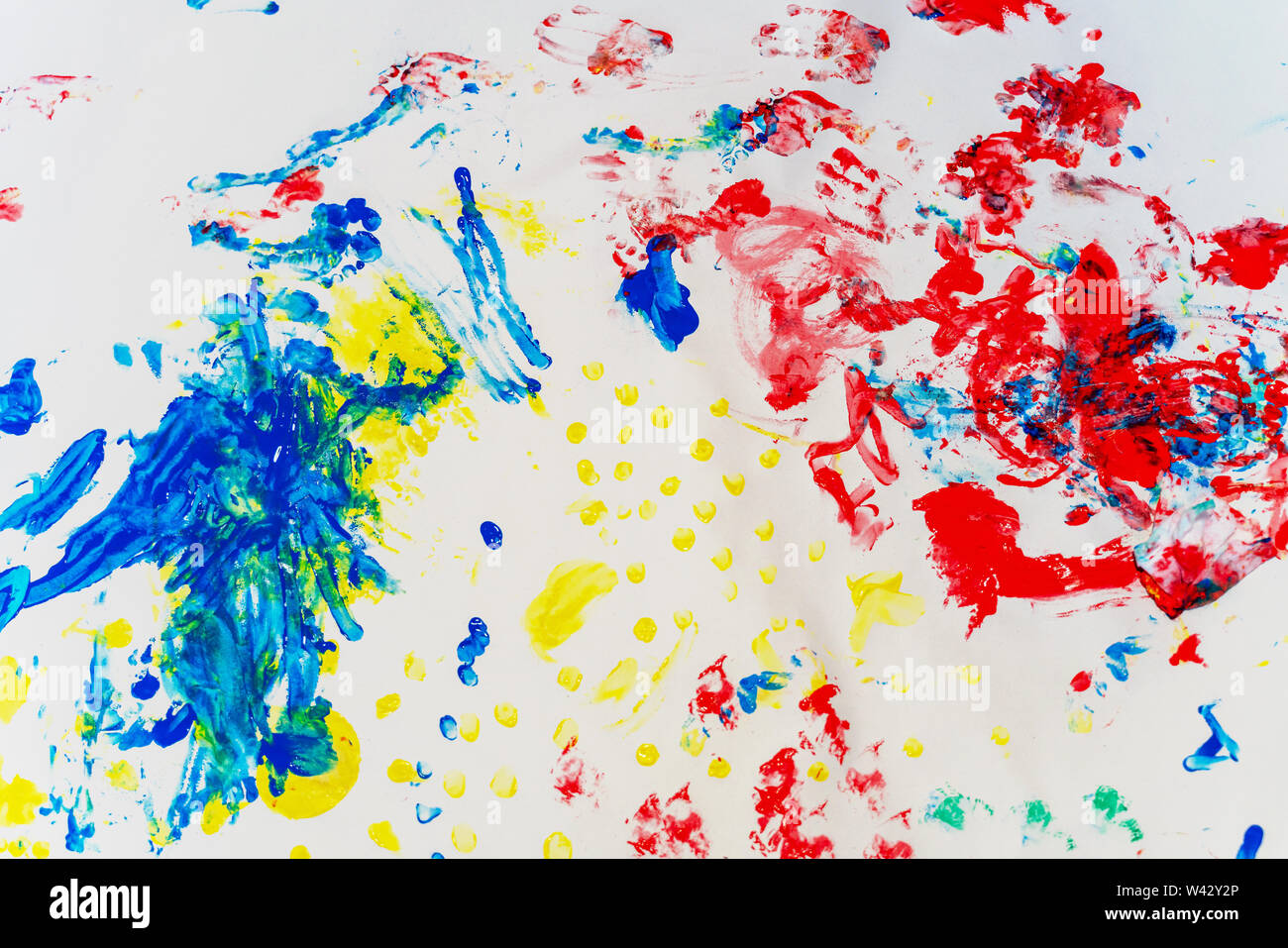 Wallpaper painted by a baby with finger paintings Stock Photo