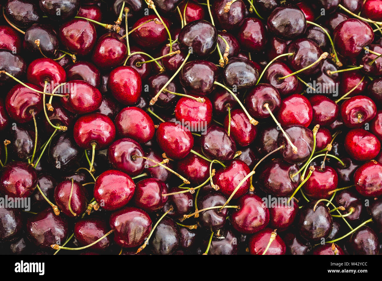 cherry fruit background many cherries closeup Stock Photo Alamy