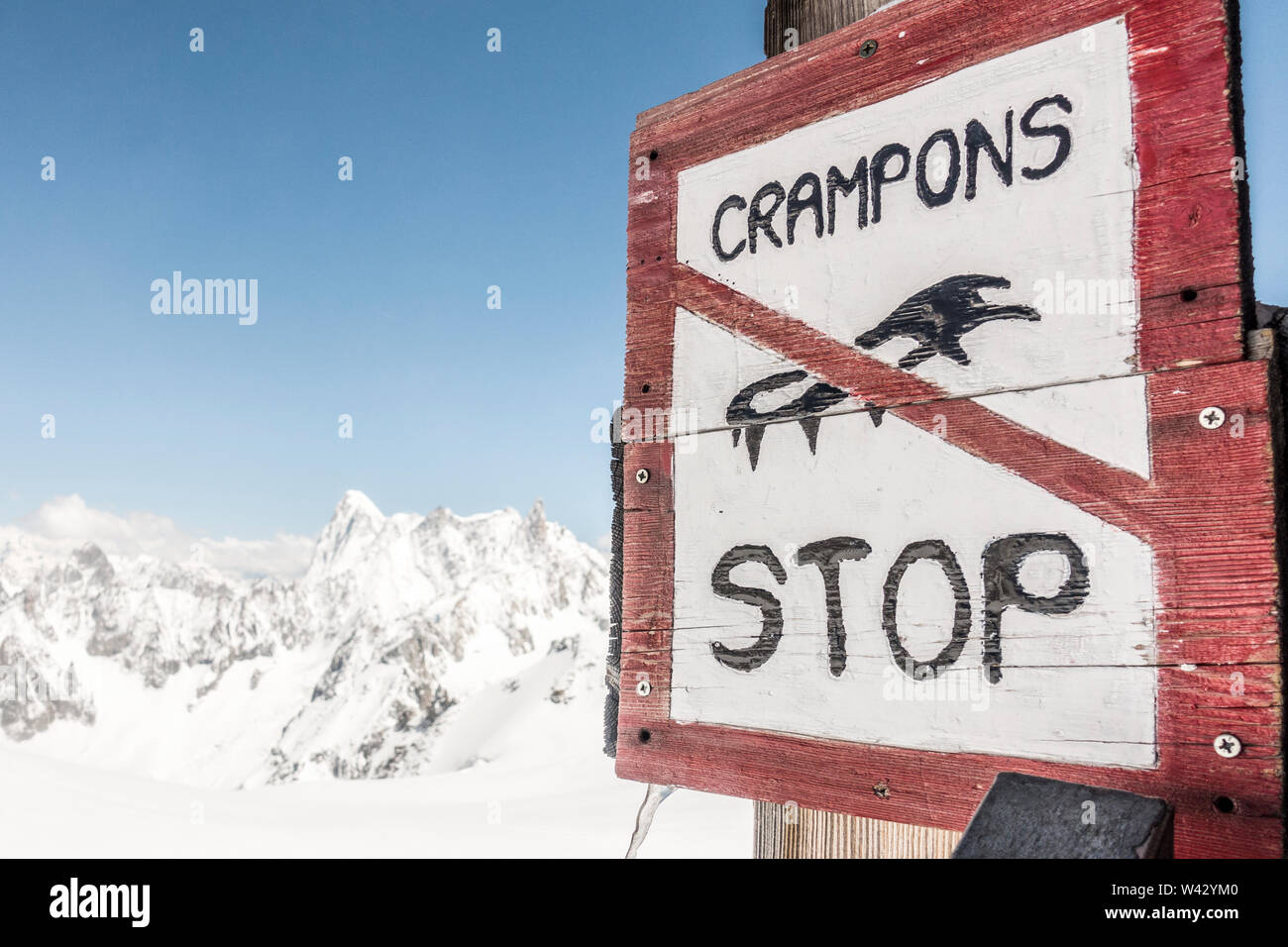 Stop sign for crampons at an alpine hut near Mont Blanc Stock Photo