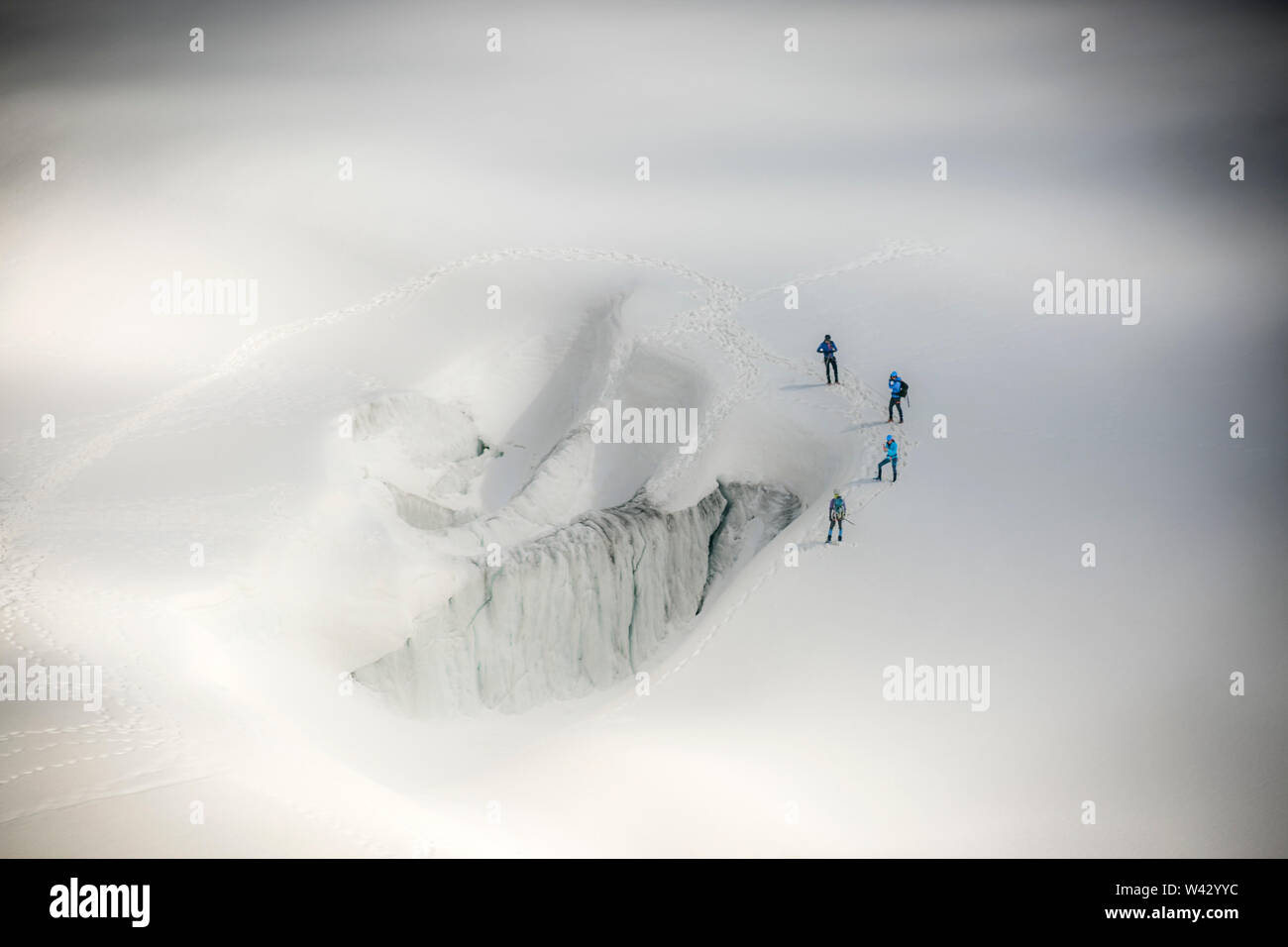 Four alpinists practice safe glacier techniques on Le Tour glacier Stock Photo