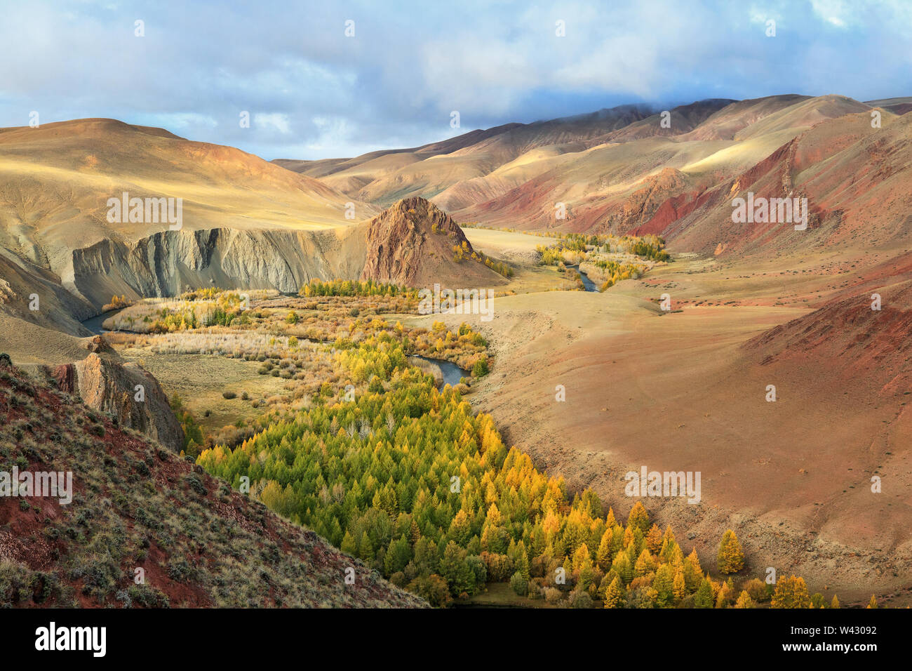 Colored mountains and valley with a river near Kokorya village. 	Kosh-Agachsky District. Altai Republic. Siberia. Russia Stock Photo