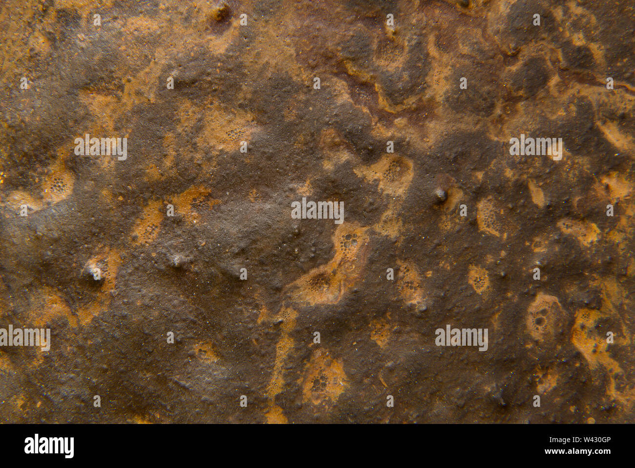 Creative background texture with rusty metal look adding to the gruny texture. Stock Photo