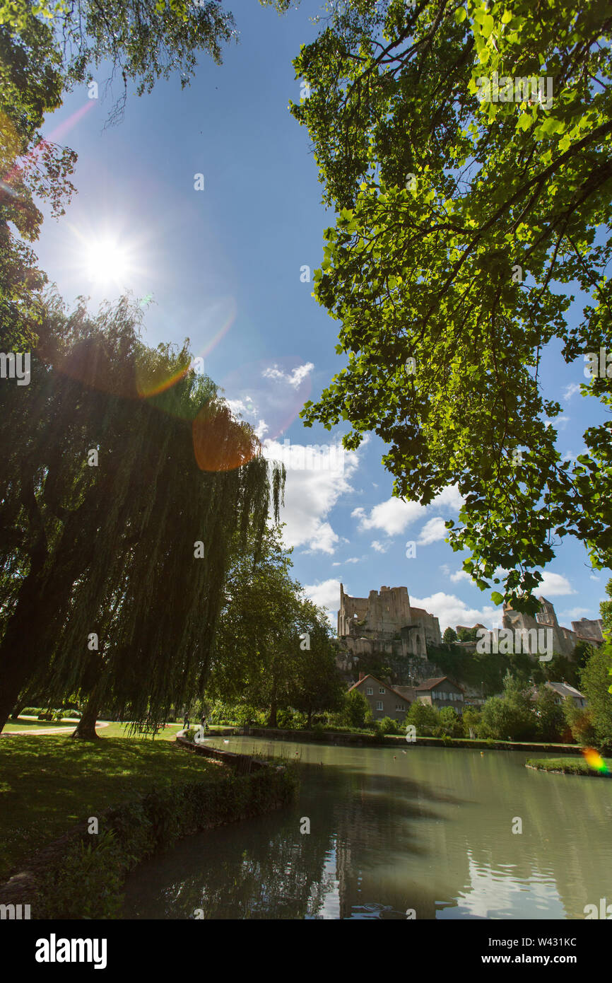 Chauvigny, France. A lake in a public garden with the Baronial Castle ruins, Donjon de Gouzon and Chateau d’Harcourt in the background. Stock Photo