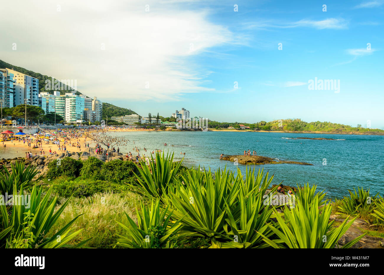 VILA VELHA, BRAZIL - DECEMBER 25th ,2016 ; Tourists on a crowded Mermaid  Beach in Vila Velha, state of Espirito Santo , Brazil. Stock Photo