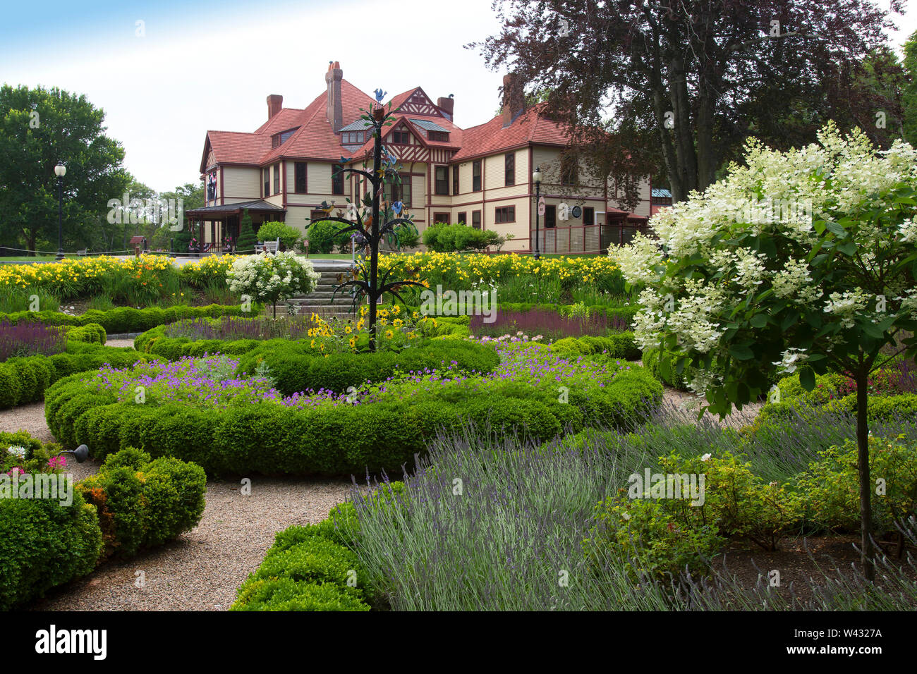 Highfield Hall, Falmouth, Massachusetts on Cape Cod. A Historic (1878) summer mansion.  As seen through a cirular garden. Stock Photo