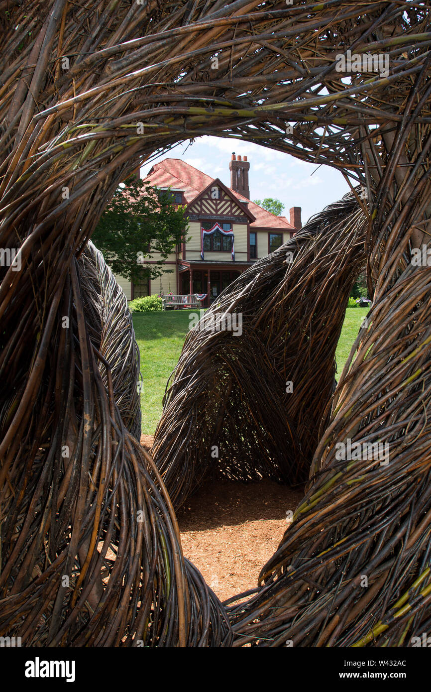 Highfield Hall, Falmouth, Massachusetts on Cape Cod. A Historic (1878) summer mansion. Also showing 'Stickwork' by artist Patrick Dougherty. Stock Photo