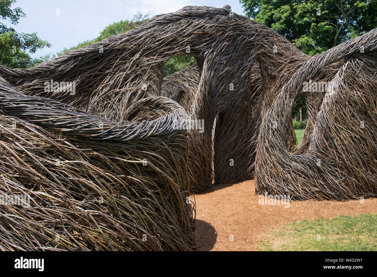 'Stickwork' a sculpture by artist Patrick Dougherty on display at Highfield, a historic summer mansion in Falmouth, Massachusetts on Cape Cod. Stock Photo