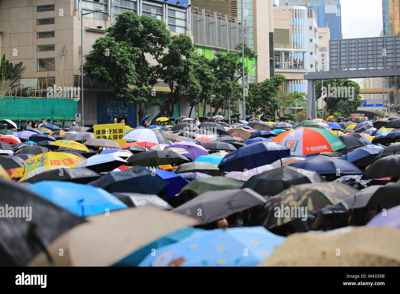 open the umbrella when the rain coming in the 7 JULY protest in hong
