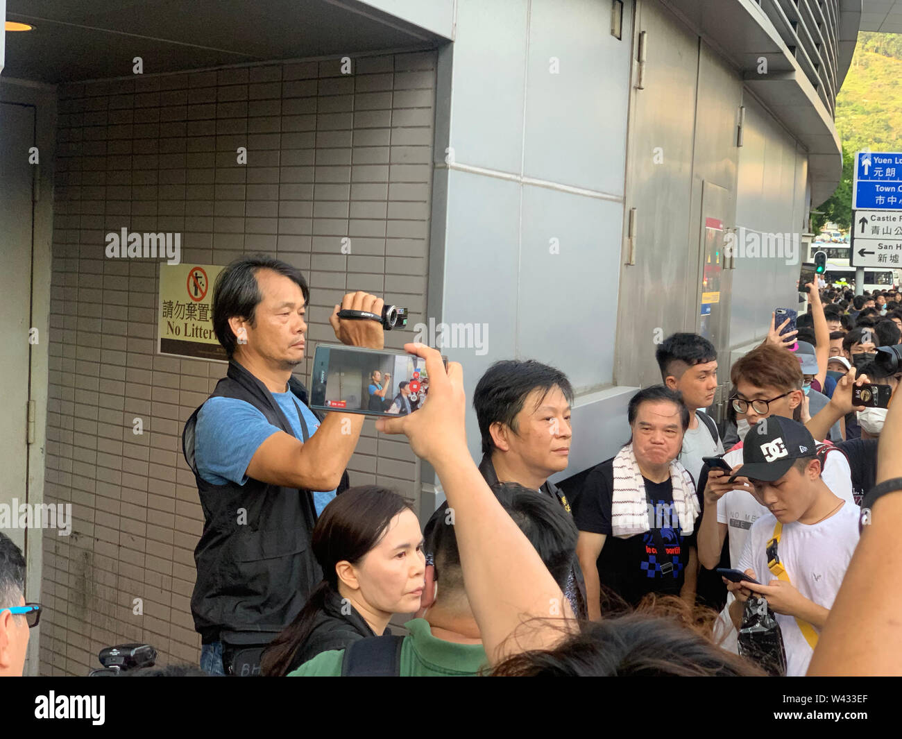 Tuen Mun, Hong Kong-July 6 2019: the police take a video and surround by the  protesters in Tuen Mun .the protesters took to the streets of Hong Kong to oppose a controversial extradition bill. Stock Photo