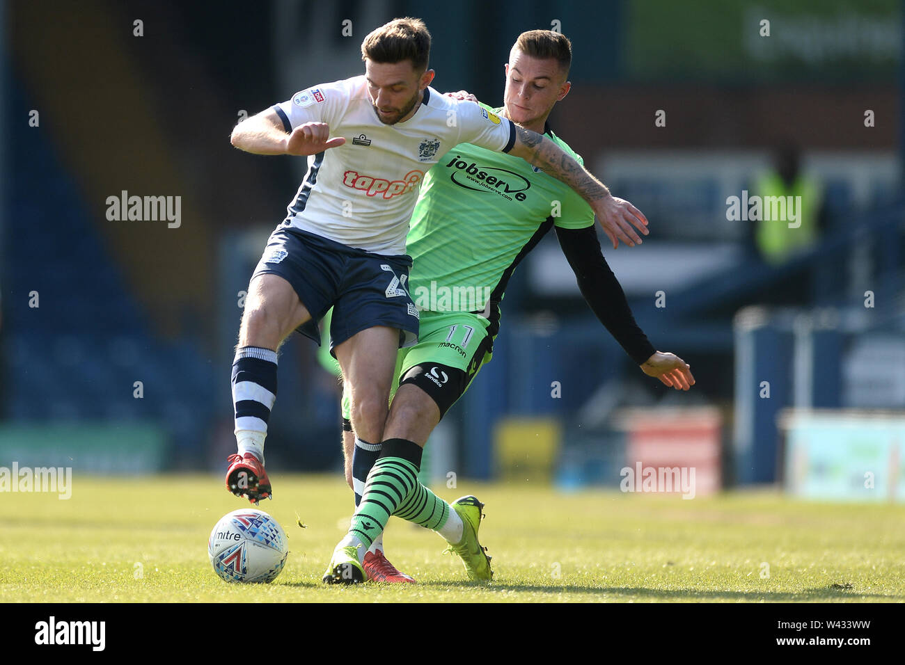 Jay O'Shea of Bury does battle with Brennan Dickenson of Colchester United - Bury v Colchester United, Sky Bet League Two, Gigg Lane, Bury - 13th April 2019  Editorial Use Only - DataCo restrictions apply Stock Photo