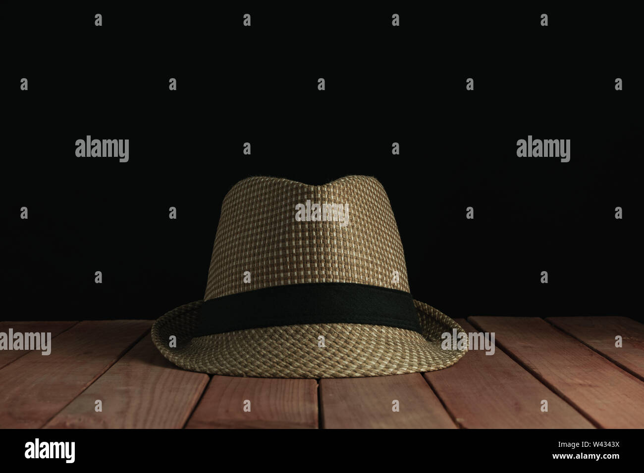 Beautiful straw hat on a red wooden table and black background Stock ...