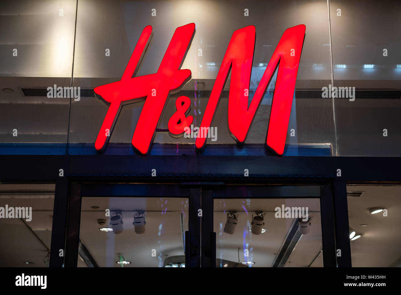 A Swedish multinational clothing-retail company Hennes & Mauritz, or H&M,  logo seen in Shanghai Stock Photo - Alamy