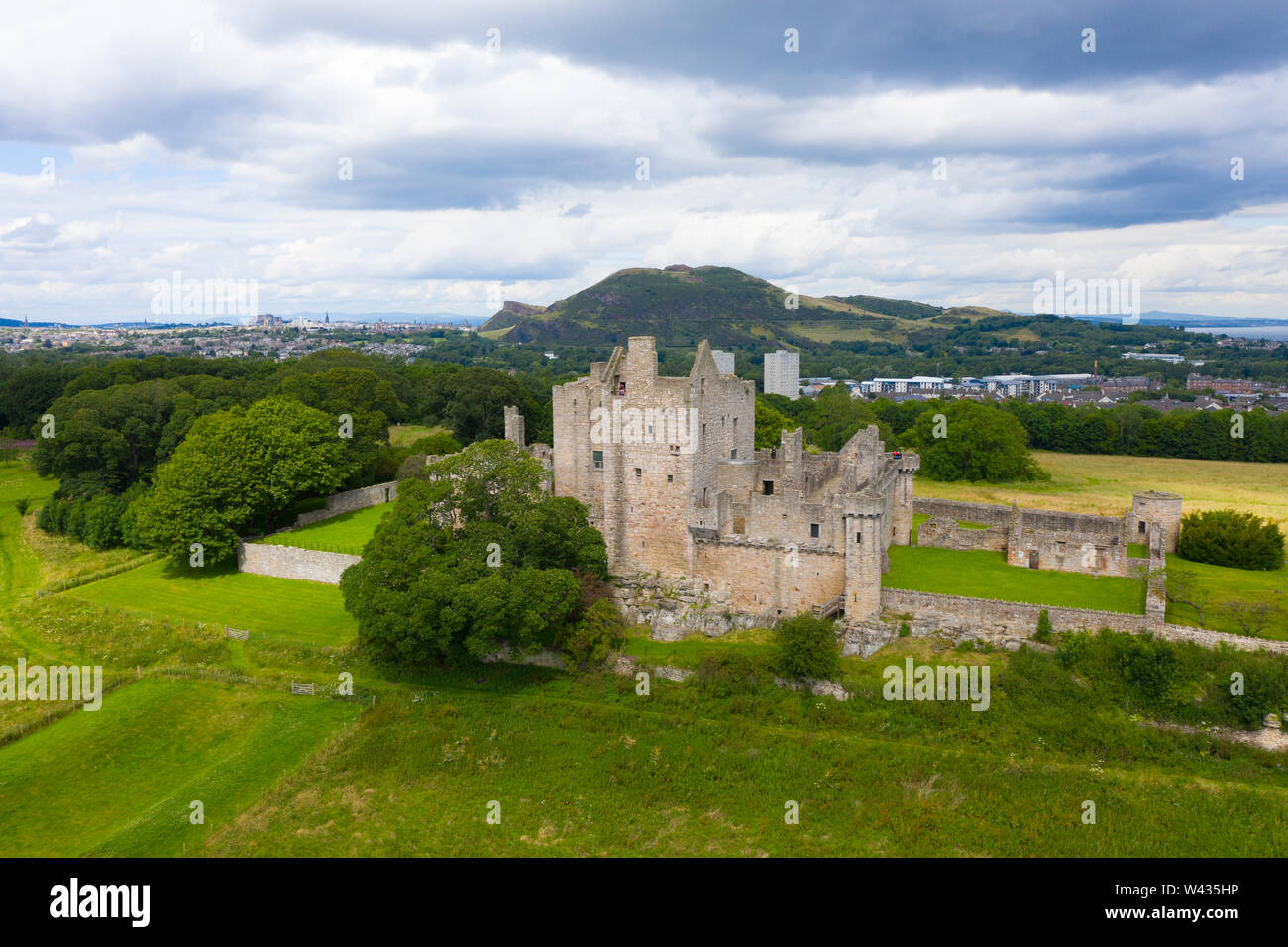 Elevated view of Craigmillar Castle and skyline of Edinburgh, Scotland UK. Stock Photo