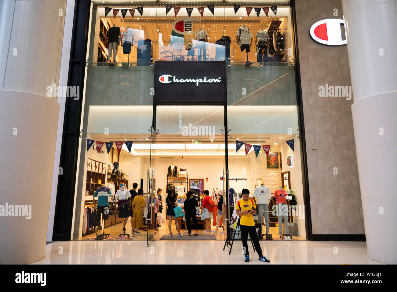 An American clothing manufacturer Champion store and logo seen in Shanghai  Stock Photo - Alamy