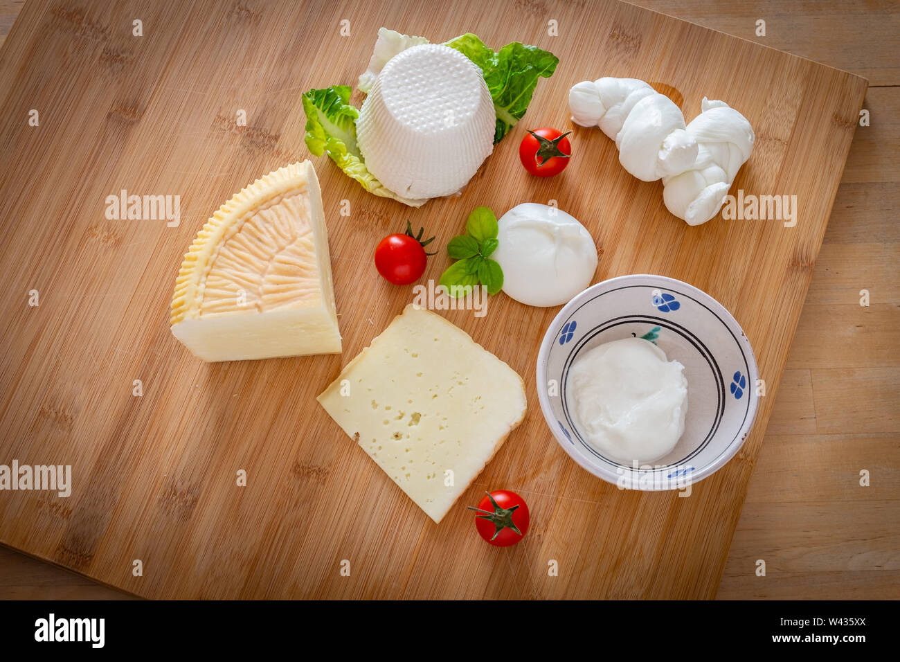 Traditional Apulian cheeses composition: pecorino, mozzarella, ricotta, burrata. Puglia, Italy Stock Photo