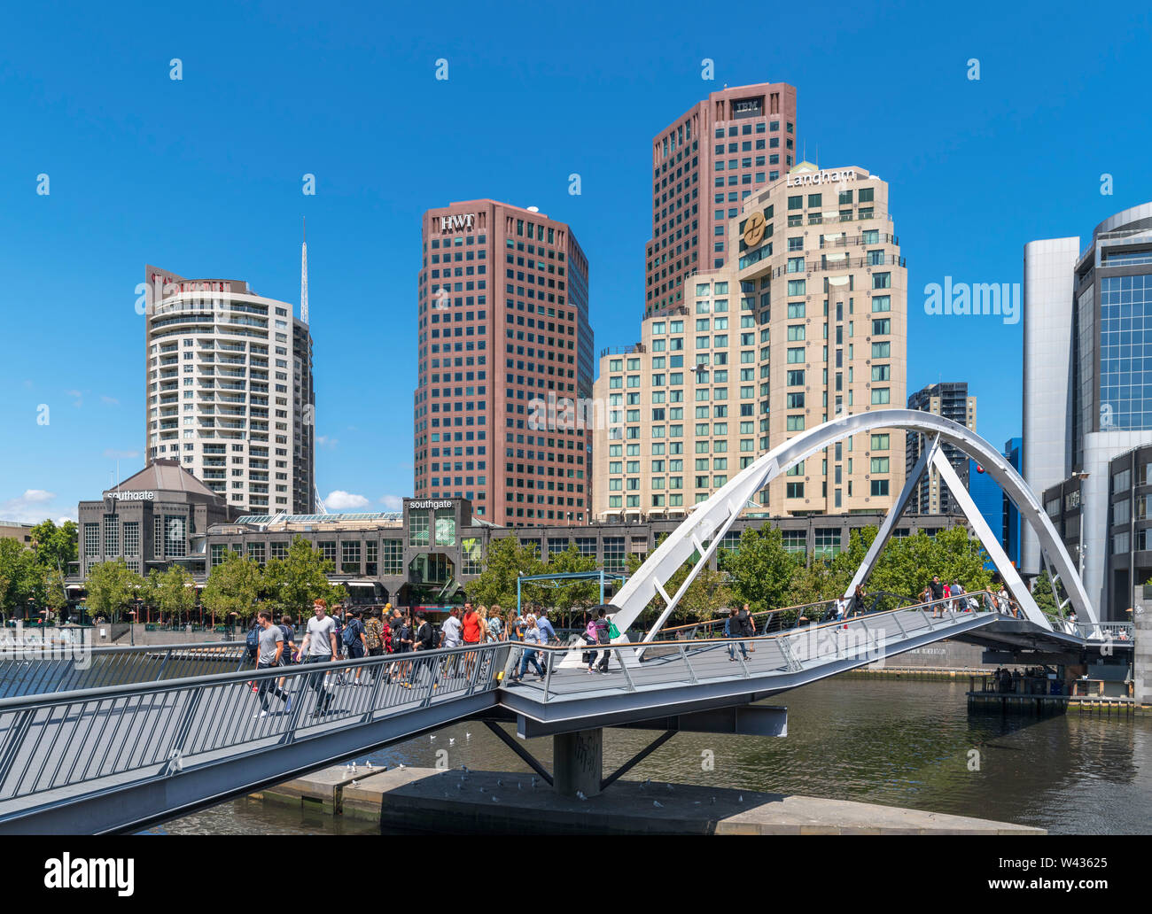 Evan Walker Bridge crossing the Yarra River with the Southgate shopping centre and skyline of Southbank behind, Melbourne, Victoria, Australia Stock Photo