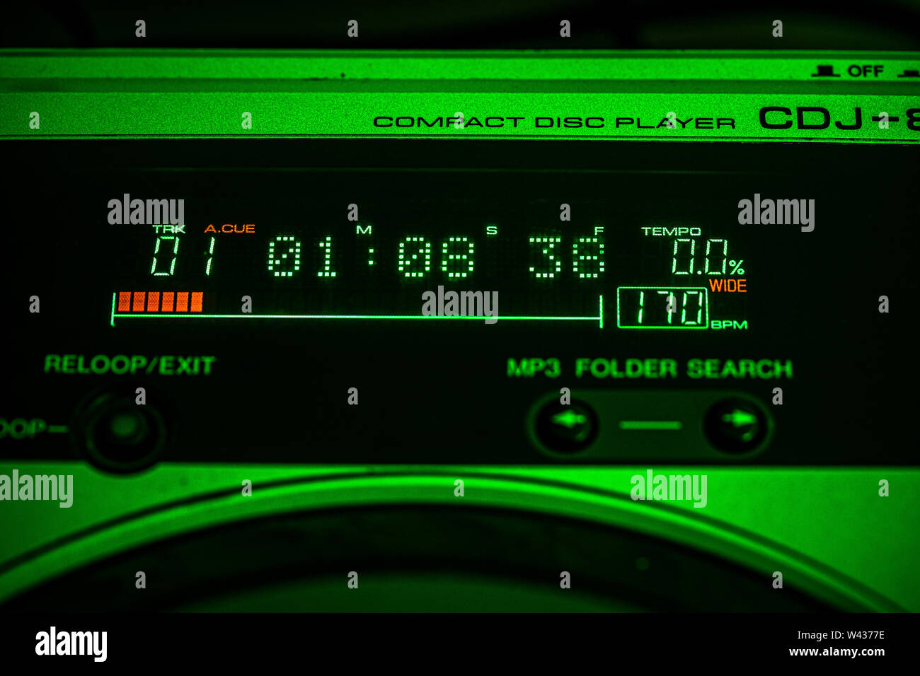 JULY 19, 2019 - MALAGA, SPAIN. Closeup of digital LED time display on a Pioneer CDJ 800 Mk2 CD Player. Green stage lighting. Stock Photo