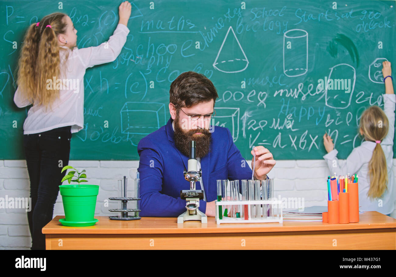 During class time. Teacher and little pupils in laboratory class ...