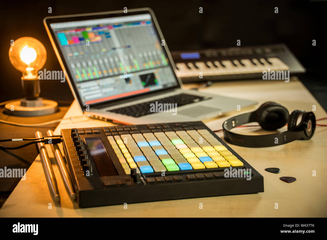 Electronic music production - Apple Macbook with Ableton Live music software, Push midi pad controller Stock Photo