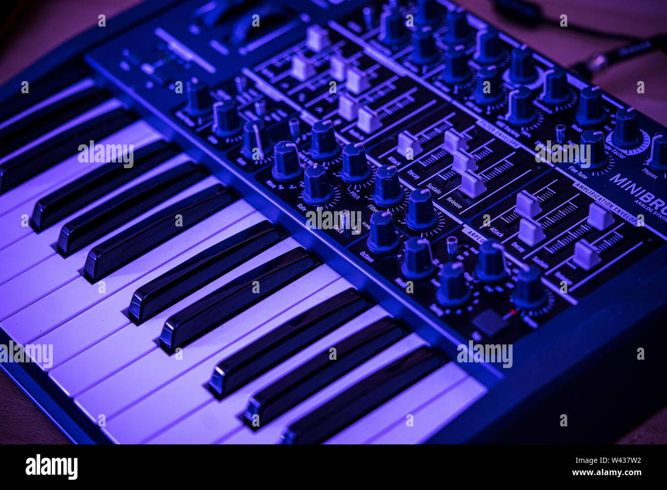 Electronic music production, an Arturia Mini Brute analog synthesizer keyboard with many dials and sliders to chang Stock Photo