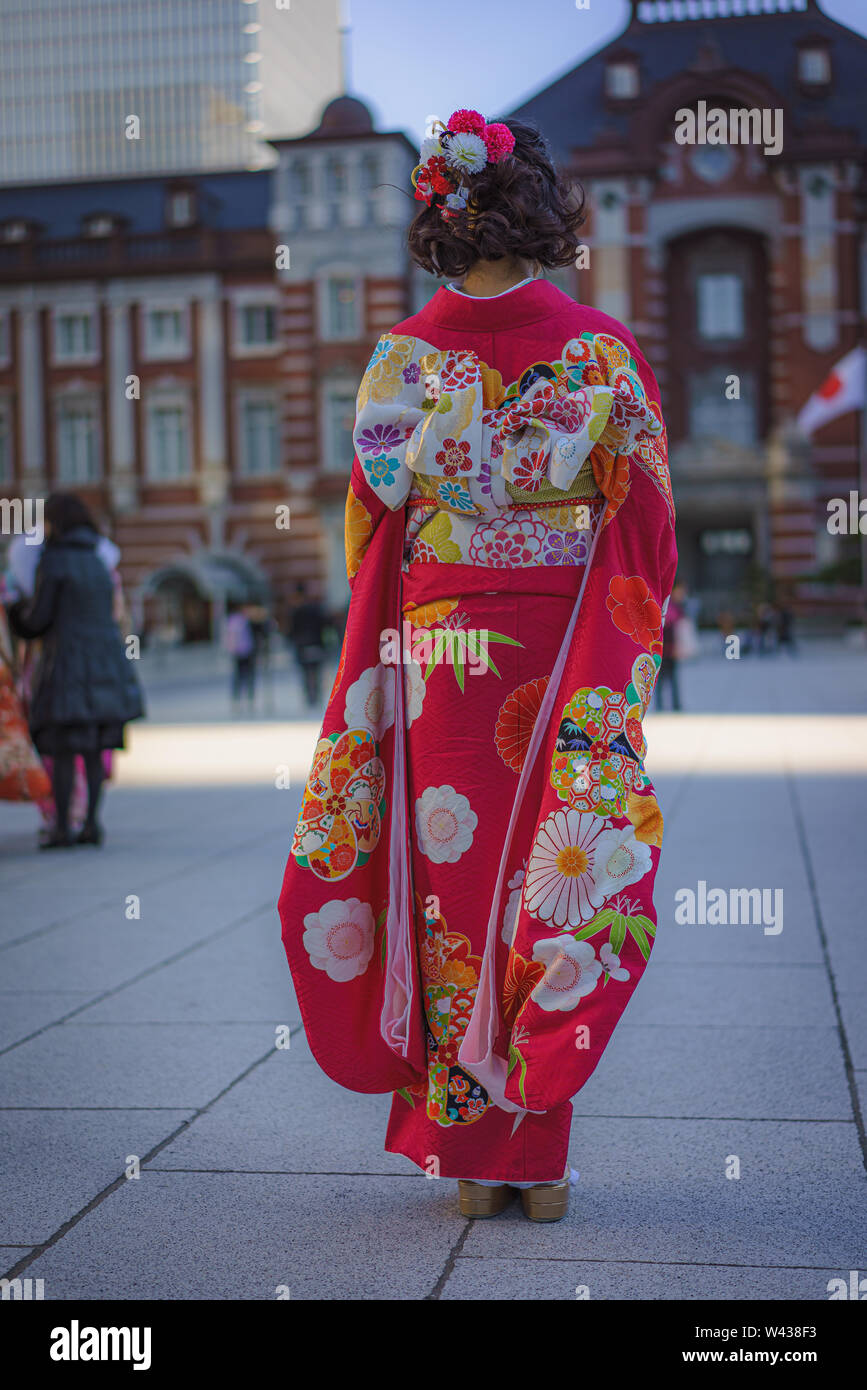 Tokyo, Japan. January 14, 2019. A woman poses in front of Tokyo station in  traditional kimono dress during the coming of age holiday Stock Photo -  Alamy